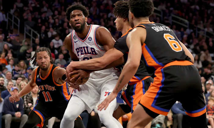 Could Joel Embiid (in white) force his way to the New York Knicks?